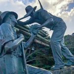 Metal sculpture depicting two returned servicemen as they work together to build Australia's Great Ocean Road