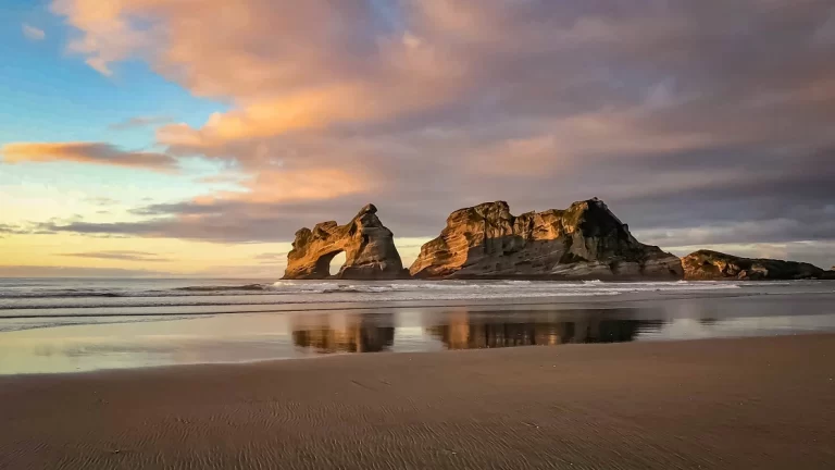 Golden hour at Wharariki Beach in Puponga, New Zealand
